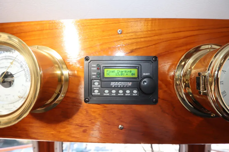 Slide: The Image of Control panel on a 2005 Monk 36 boat with brass instruments and digital display. - 41
