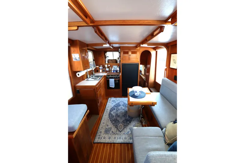 Slide: The Image of Interior of 2005 Monk 36 boat with cozy seating and wooden finishes. - 44