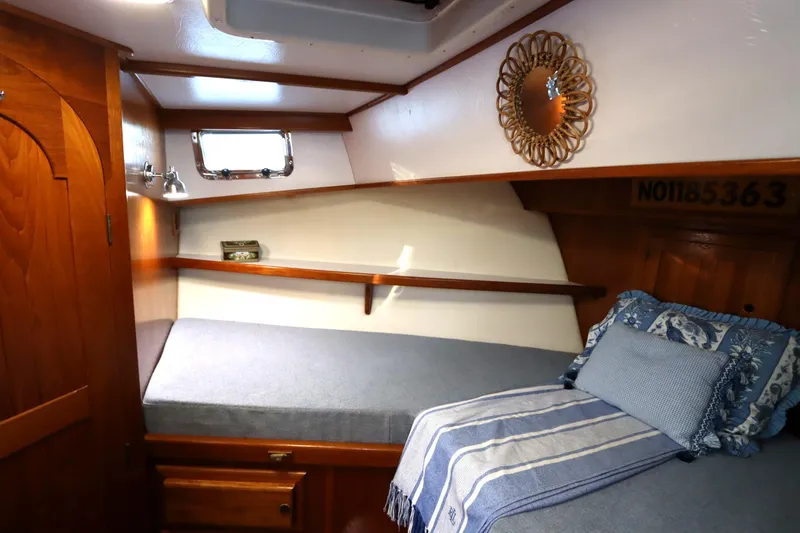 Slide: The Image of Cozy cabin interior of 2005 Monk 36 boat with wooden accents and nautical decor. - 62