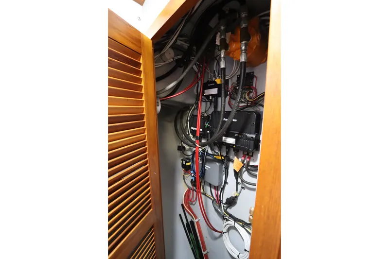 Slide: The Image of Electrical wiring and components inside a 2005 Monk 36 boat cabinet. - 64