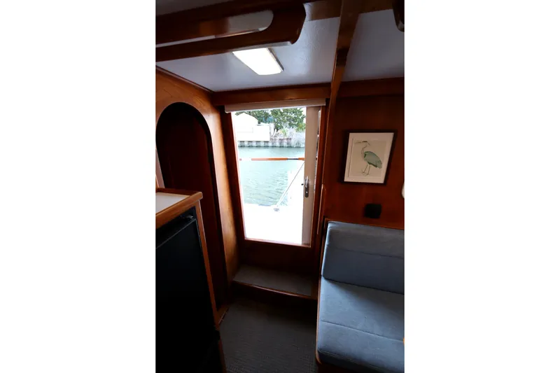 Slide: The Image of Interior of 2005 Monk 36 boat with wooden finish and water view. - 67