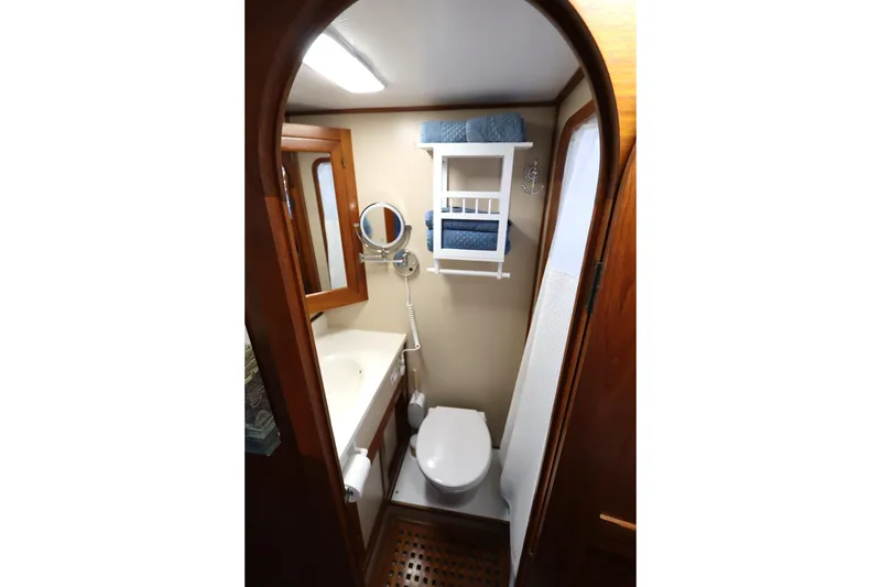 Slide: The Image of Compact bathroom in 2005 Monk 36 boat with wooden accents and modern fixtures. - 78
