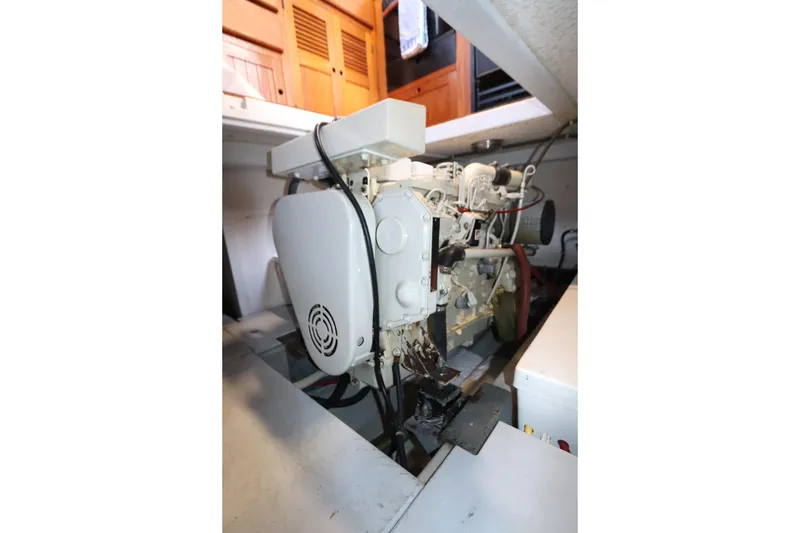 Slide: The Image of Engine compartment of a 2005 Monk 36 boat, showcasing mechanical components. - 82