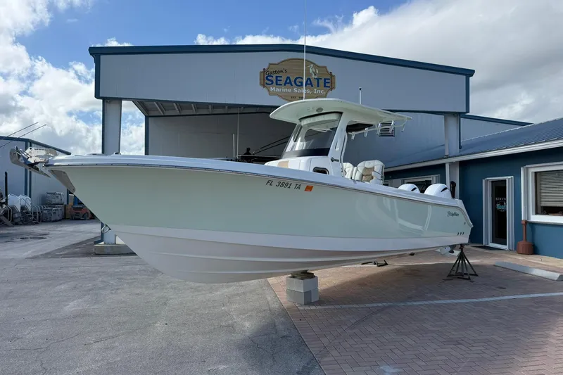 The Image of 2021 Edgewater 262CC boat displayed at Seagate Marine Sales, Inc. dealership. - 0
