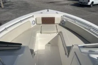 Slide: The Image of 2023 Cobia 220 Dual Console boat interior with spacious seating and modern design. - 10