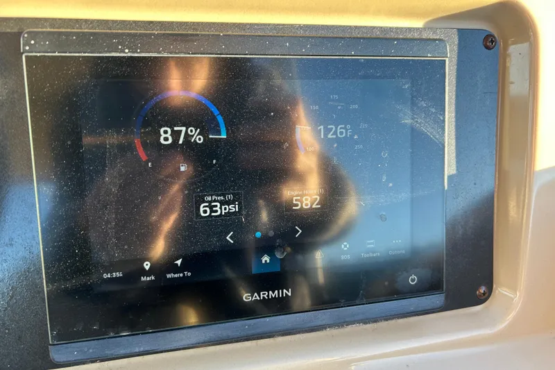 Slide: The Image of Garmin display on 2022 Godfrey Sweetwater 2286 C showing fuel, oil pressure, and engine hours. - 19