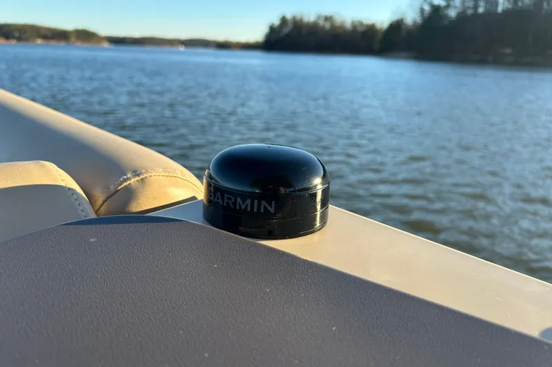 Slide: The Image of 2022 Godfrey Sweetwater 2286 C boat with Garmin device on calm lake. - 21