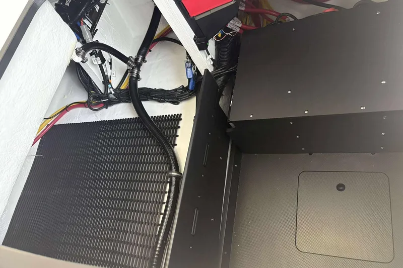 Slide: The Image of Engine compartment of 2026 Monterey Elite 30 OB boat, showcasing wiring and components. - 12