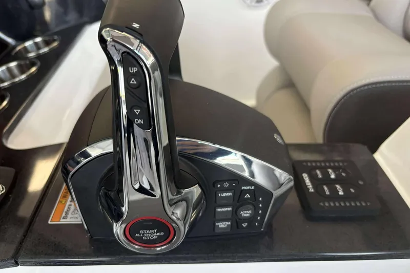 Slide: The Image of Throttle control panel of 2026 Monterey Elite 30 OB boat, featuring start/stop button. - 13
