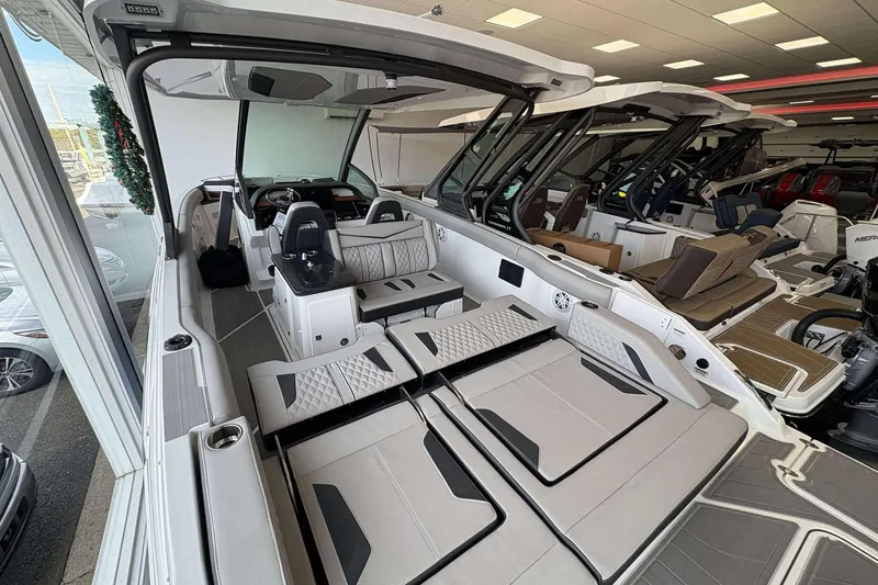 Slide: The Image of 2026 Monterey Elite 30 OB boat interior with luxurious seating and modern design. - 26