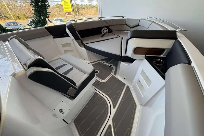 Slide: The Image of 2026 Monterey Elite 30 OB boat interior with sleek seating and modern design. - 29