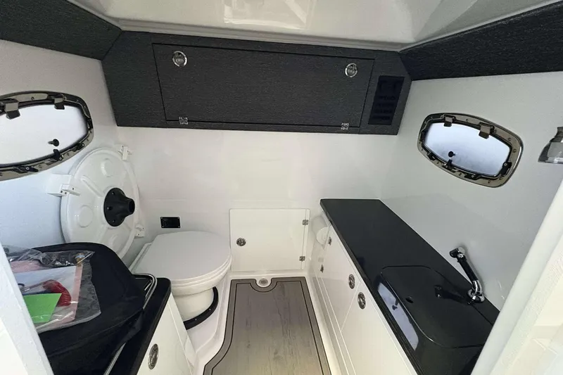 Slide: The Image of 2026 Monterey Elite 30 OB boat interior with modern bathroom amenities. - 30