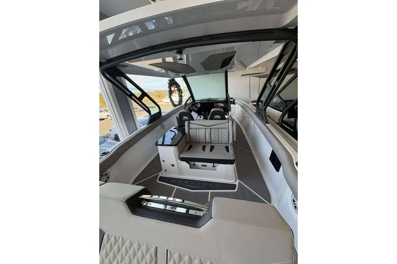 Slide: The Image of 2026 Monterey Elite 30 OB boat interior with luxurious seating and modern design. - 36