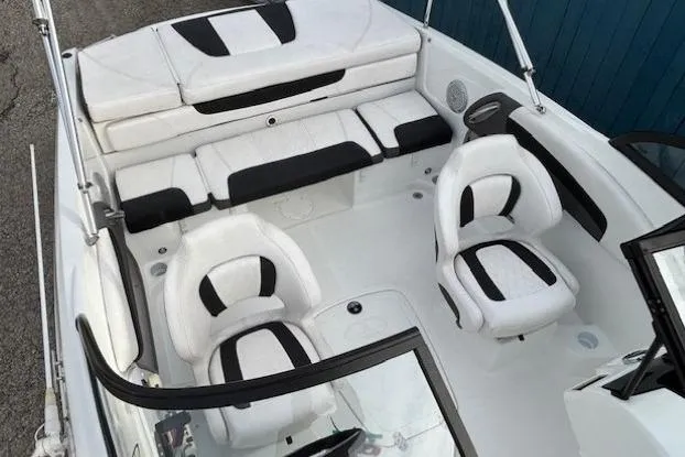 Slide: The Image of 2019 Tahoe 500 TS boat interior with white and black seating arrangement. - 11
