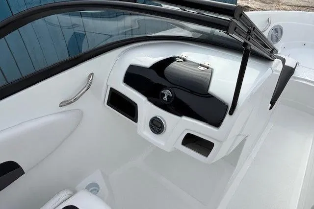 Slide: The Image of 2019 Tahoe 500 TS boat dashboard with sleek black and white design. - 12