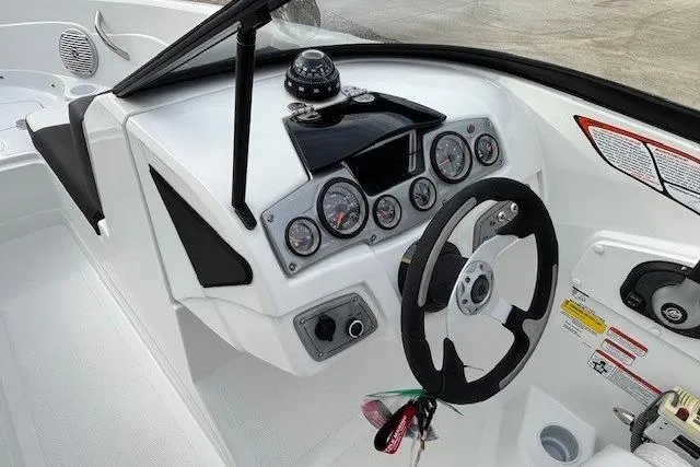 Slide: The Image of 2019 Tahoe 500 TS boat dashboard with steering wheel and instrument panel. - 13