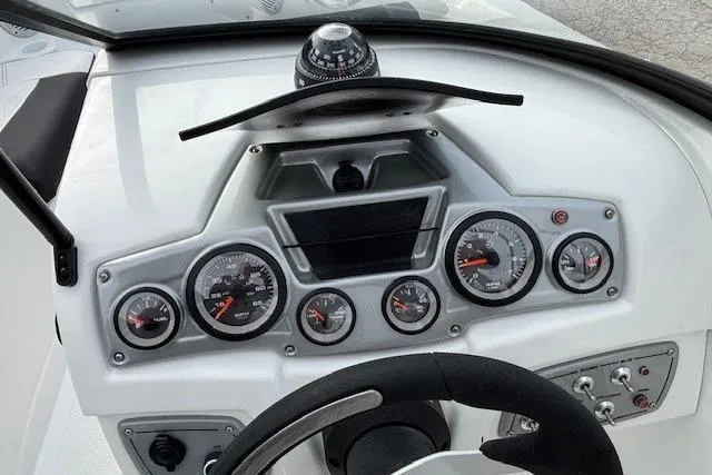 Slide: The Image of Dashboard of 2019 Tahoe 500 TS boat with gauges and compass. - 15