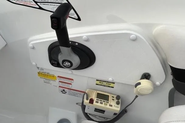 Slide: The Image of Control panel of a 2019 Tahoe 500 TS boat with throttle and electronic display. - 16