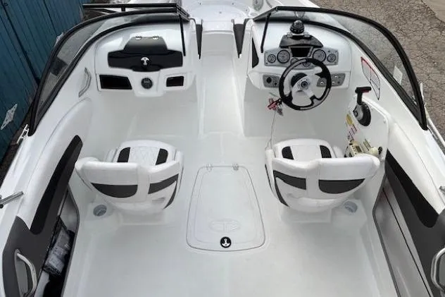 Slide: The Image of 2019 Tahoe 500 TS boat interior with dual seats and modern dashboard controls. - 19