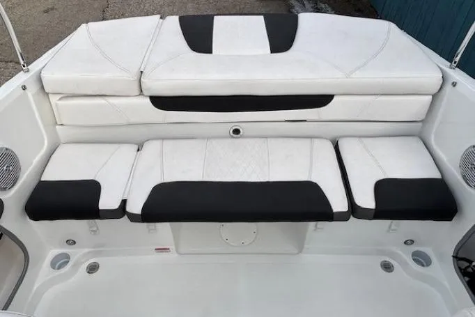 Slide: The Image of 2019 Tahoe 500 TS boat interior with white and black cushioned seating. - 21