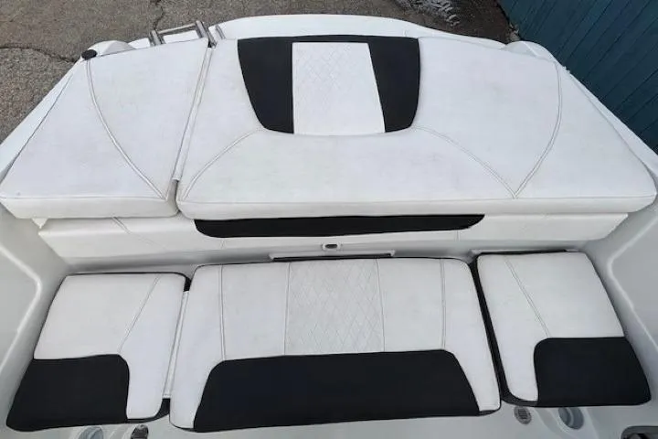 Slide: The Image of 2019 Tahoe 500 TS boat interior with white and black cushioned seating. - 25