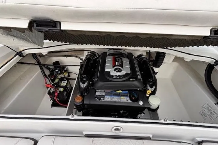 Slide: The Image of 2019 Tahoe 500 TS boat engine compartment with visible components and wiring. - 26