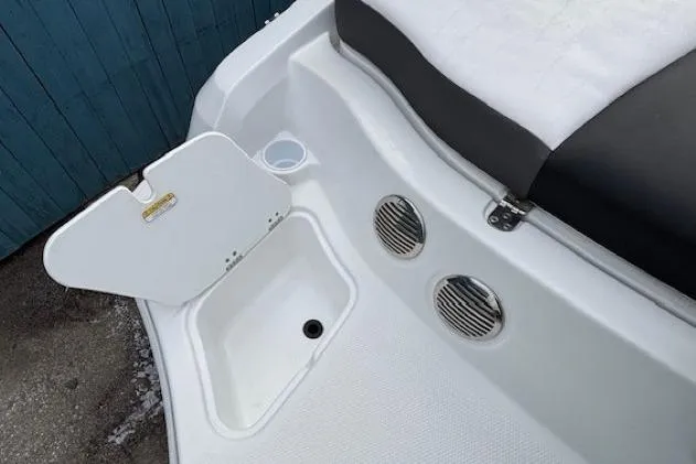 Slide: The Image of 2019 Tahoe 500 TS boat interior with storage compartment and seating area. - 27