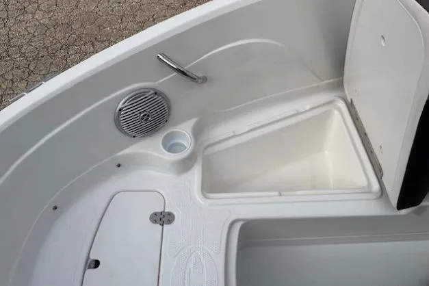 Slide: The Image of 2019 Tahoe 500 TS boat interior with storage compartment and speaker. - 9