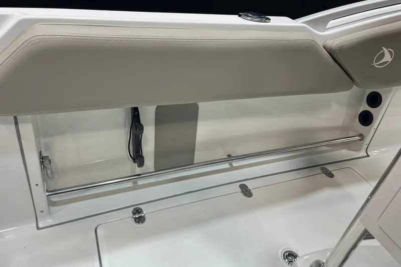 Slide: The Image of 2023 Crownline 220 CC Finseeker boat interior storage compartment with sleek design and modern features. - 10