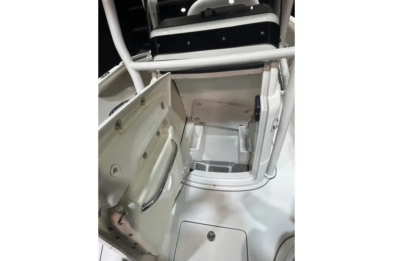 Slide: The Image of 2023 Crownline 220 CC Finseeker boat interior with open storage compartment. - 14