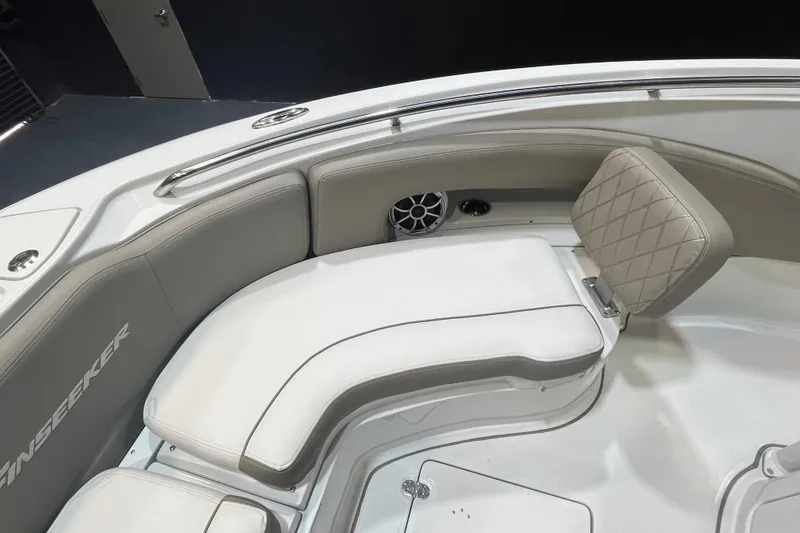 Slide: The Image of 2023 Crownline 220 CC Finseeker boat interior with cushioned seating and speaker. - 16