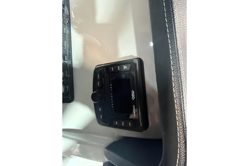 Slide: The Image of Control panel of 2023 Crownline 220 CC Finseeker boat, featuring a modern interface. - 18