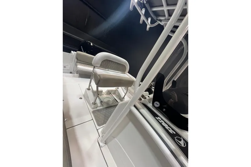 Slide: The Image of 2023 Crownline 220 CC Finseeker boat interior with seating and console details. - 22