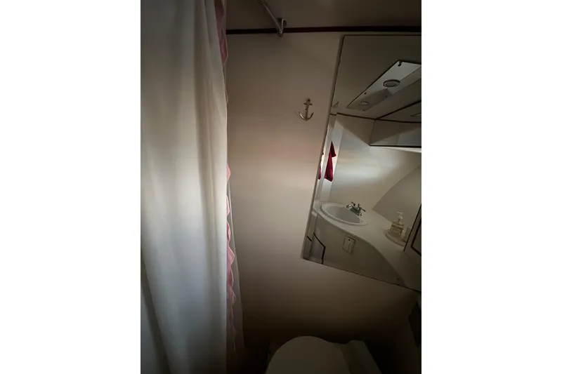 Slide: The Image of Bathroom interior of 1988 Carmague 48 CPMY yacht with mirror and shower curtain. - 14
