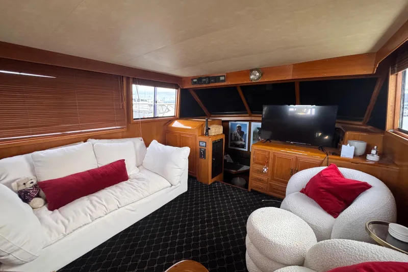 Slide: The Image of Luxurious 1988 Carmague 48 CPMY yacht interior with cozy seating and modern decor. - 18