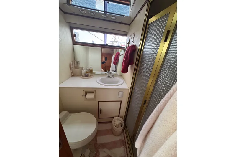 Slide: The Image of Bathroom interior of 1988 Carmague 48 CPMY yacht with sink, toilet, and shower. - 20
