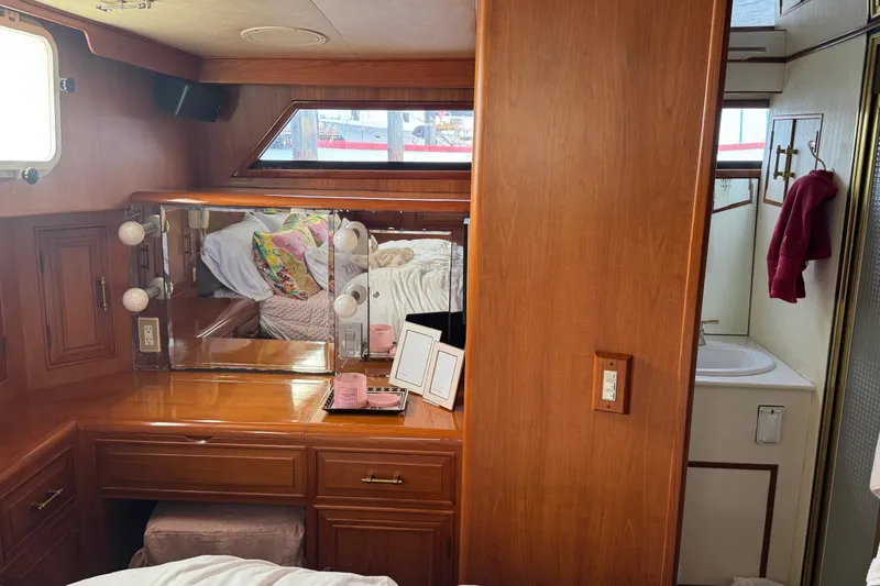 Slide: The Image of Luxurious 1988 Carmague 48 CPMY yacht interior with vanity and bathroom. - 21