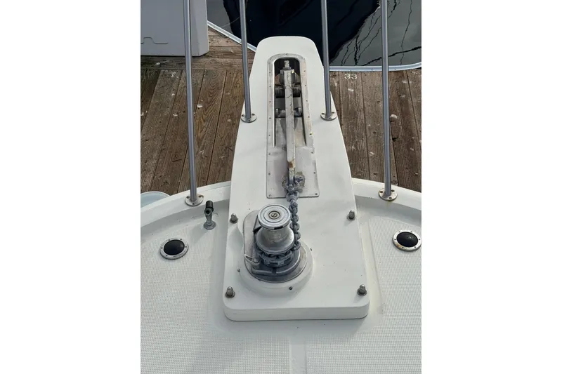 Slide: The Image of Bow deck of 1988 Carmague 48 CPMY yacht with anchor winch and chain. - 26