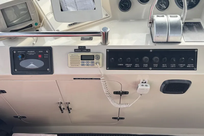 Slide: The Image of Control panel of a 1988 Carmague 48 CPMY yacht with various switches and instruments. - 31