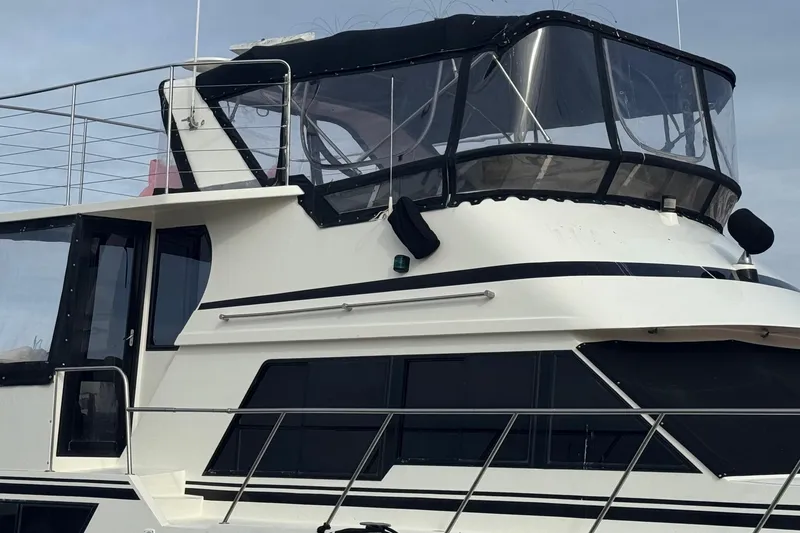 Slide: The Image of 1988 Carmague 48 CPMY yacht with sleek design and spacious upper deck. - 40