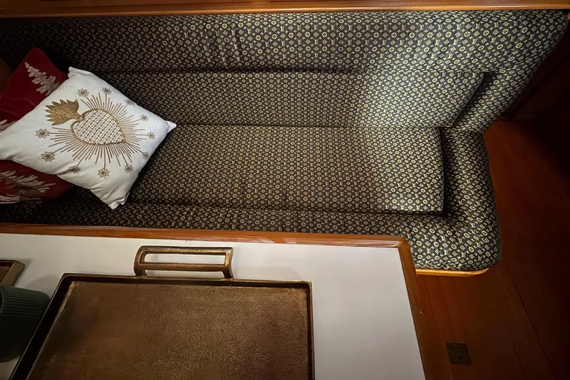 Slide: The Image of Luxurious seating area on 1988 Carmague 48 CPMY yacht with decorative pillows. - 6