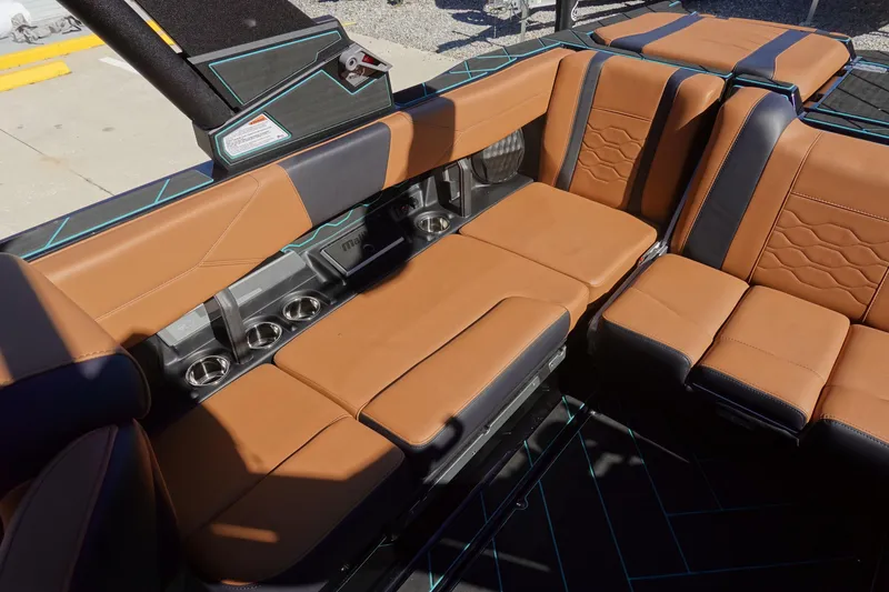 Slide: The Image of Luxurious interior of 2026 Malibu Wakesetter 23 LSV with tan and black seating. - 12