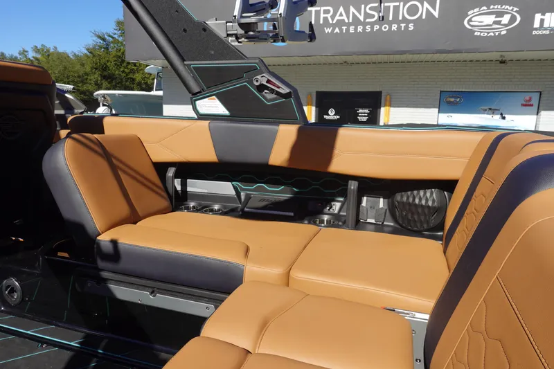 Slide: The Image of 2026 Malibu Wakesetter 23 LSV interior with tan and black seating, showcasing luxury design. - 14