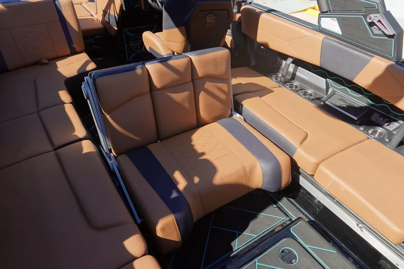 Slide: The Image of 2026 Malibu Wakesetter 23 LSV interior with luxurious tan and black seating. - 17