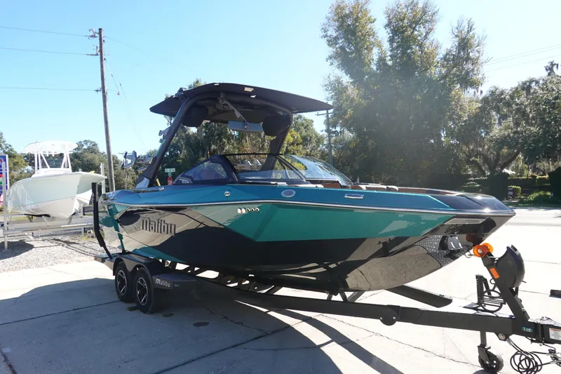 Slide: The Image of 2026 Malibu Wakesetter 23 LSV boat on trailer, parked outdoors. - 2