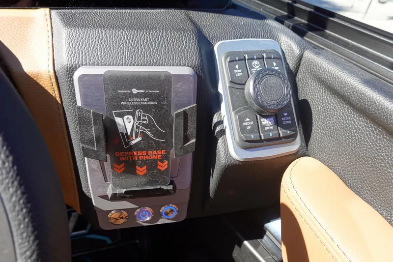 Slide: The Image of 2026 Malibu Wakesetter 23 LSV dashboard with wireless charging and control panel. - 25