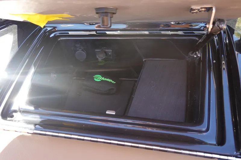 Slide: The Image of Open storage compartment in 2026 Malibu Wakesetter 23 LSV boat. - 33