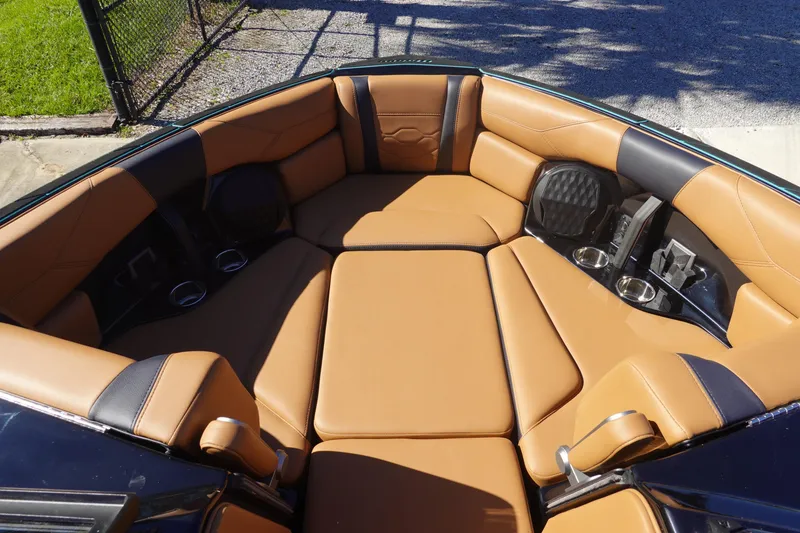 Slide: The Image of 2026 Malibu Wakesetter 23 LSV interior with tan leather seating and cup holders. - 34
