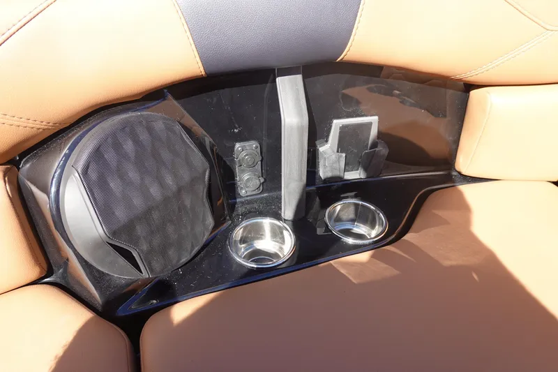 Slide: The Image of 2026 Malibu Wakesetter 23 LSV interior with speaker, cup holders, and phone holder. - 38