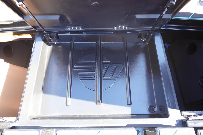Slide: The Image of 2026 Malibu Wakesetter 23 LSV storage compartment with logo detail. - 40